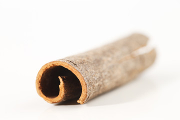 Whole cinnamon sticks against a white background