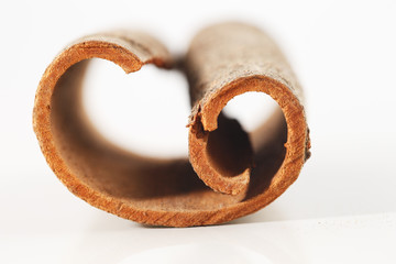 Whole cinnamon sticks against a white background