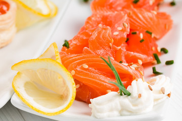 Sliced ​​salmon with lemon