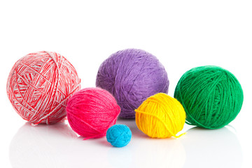 colorful different thread balls. wool knitting on white backgrou