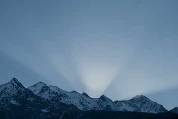 sunset rays over the mountain range