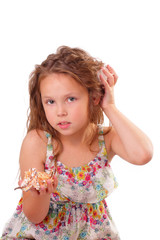 Beautiful little girl with starfish and seashell