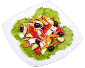 Fresh vegetable greek salad isolated on white background