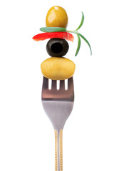 Fork with snack: olives and paprika with fresh rosemary