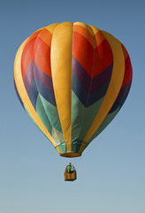 Fototapeta premium Hot-air balloon floating in a blue sky