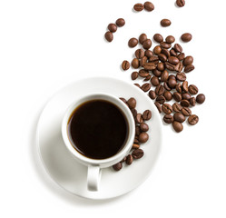 Cup of coffee with a coffee beans around, top view