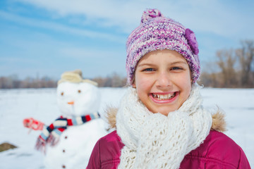 Girl with a snowman