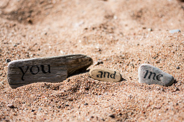 Words written on pieces of tree and stones