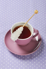 Tea in cup with candy sugar