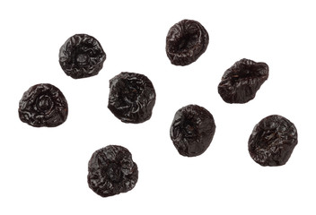 Isolated dried plums over white background, close up
