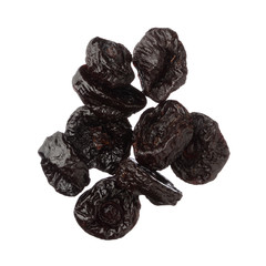 Isolated dried plums over white background, close up