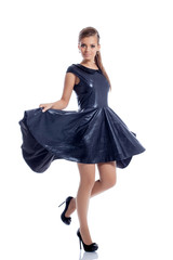 Lovely brunette posing in trendy dark blue dress