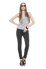 Fototapeta premium Full length The young long-haired girl in sunglasses