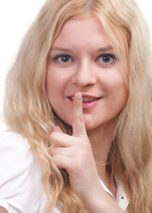 Fototapeta premium Young girl asking for silence