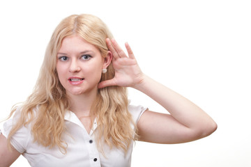 woman eavesdropping with hand behind her ear
