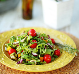 Fresh salad served on vintage plate