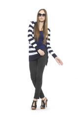 young woman in stripy shirt with sunglasses posing at studio