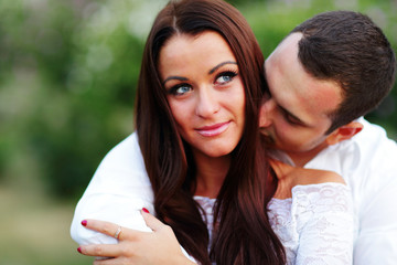 young romantic couple embracing each other