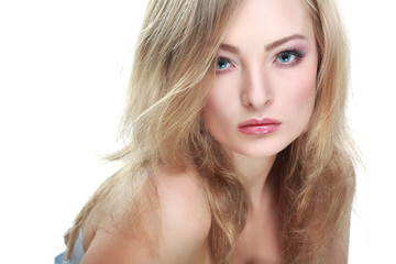 portrait of  whiteheaded young woman with  blue eyes on white 