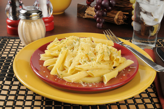 Buttered penne rigate noodles with Parmesan cheese