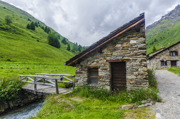 Fototapeta na wymiar Stone houses. Traditional alpine village in the mountains