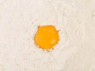 Egg yolk isolated on flour.