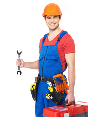 Portrait of smiling worker with tools