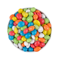 Candy sea pebbles in a white bowl on a white background