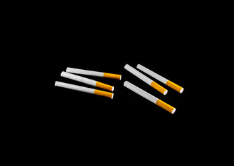 many cigarette isolated on black background