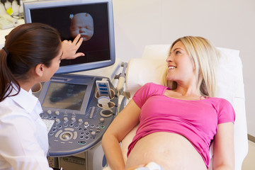 Fototapeta na wymiar Pregnant Woman Having 4D Ultrasound Scan