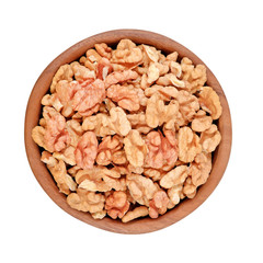 Peeled walnuts in a wooden bowl on a white background