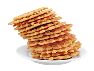 Pile of sweet waffles on a plate.