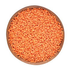 Red raw lentil in a wooden bowl on a white background