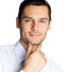 Portrait of thinking businessman, on white