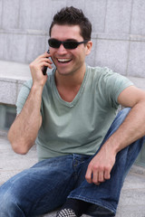 Casual young man on the phone