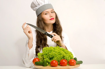Beautiful chef eating a green salad for a perfect healthy life
