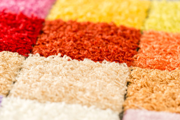 A variety of colorful carpet swatches