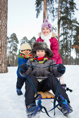 Children on sleds in snow