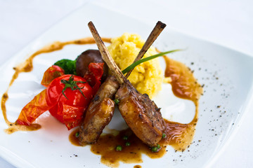 lamb steak  on white plate