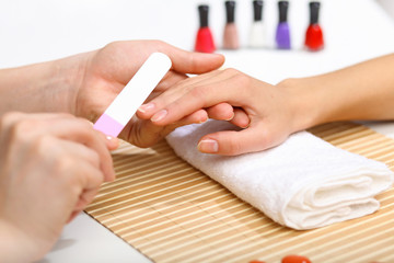 Obraz na płótnie Canvas Woman is getting manicure