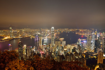 Hong Kong city skyline panorama at night with Victoria Harbor an