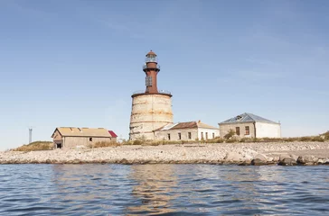 Papier Peint photo Phare Ancient lighthouse on an island