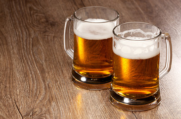 Two glass beer on wooden table
