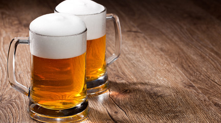 Two glass beer on wooden table