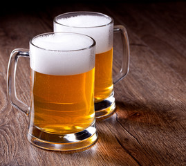 Two glass beer on wooden table