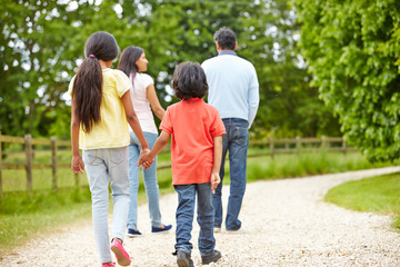 Obraz premium Indian Family Walking In Countryside