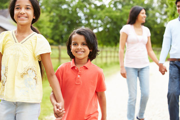 Indian Family Walking In Countryside