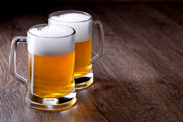 Two glass beer on wooden table