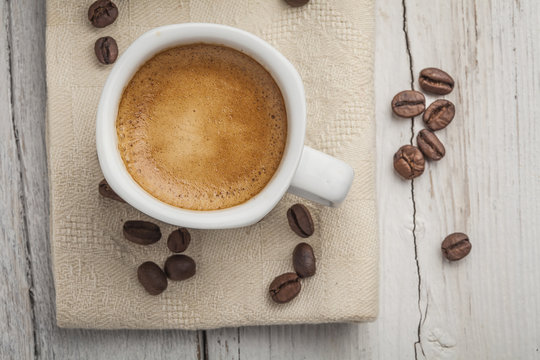 Coffee beans with coffee cup