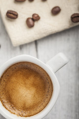 Coffee beans with coffee cup